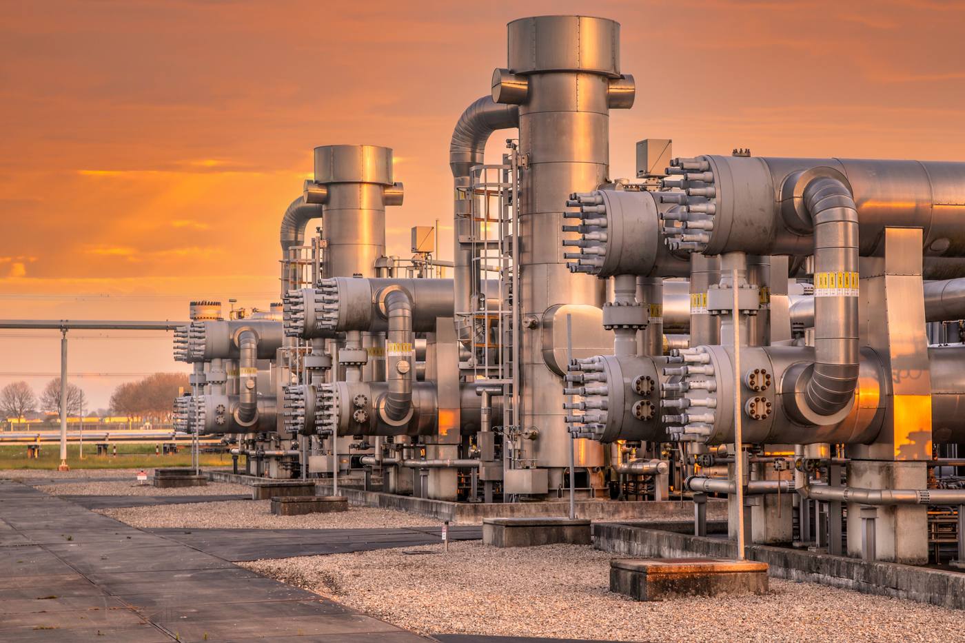 Gas treatment plant in Groningen with pipes and vessels in the evening light